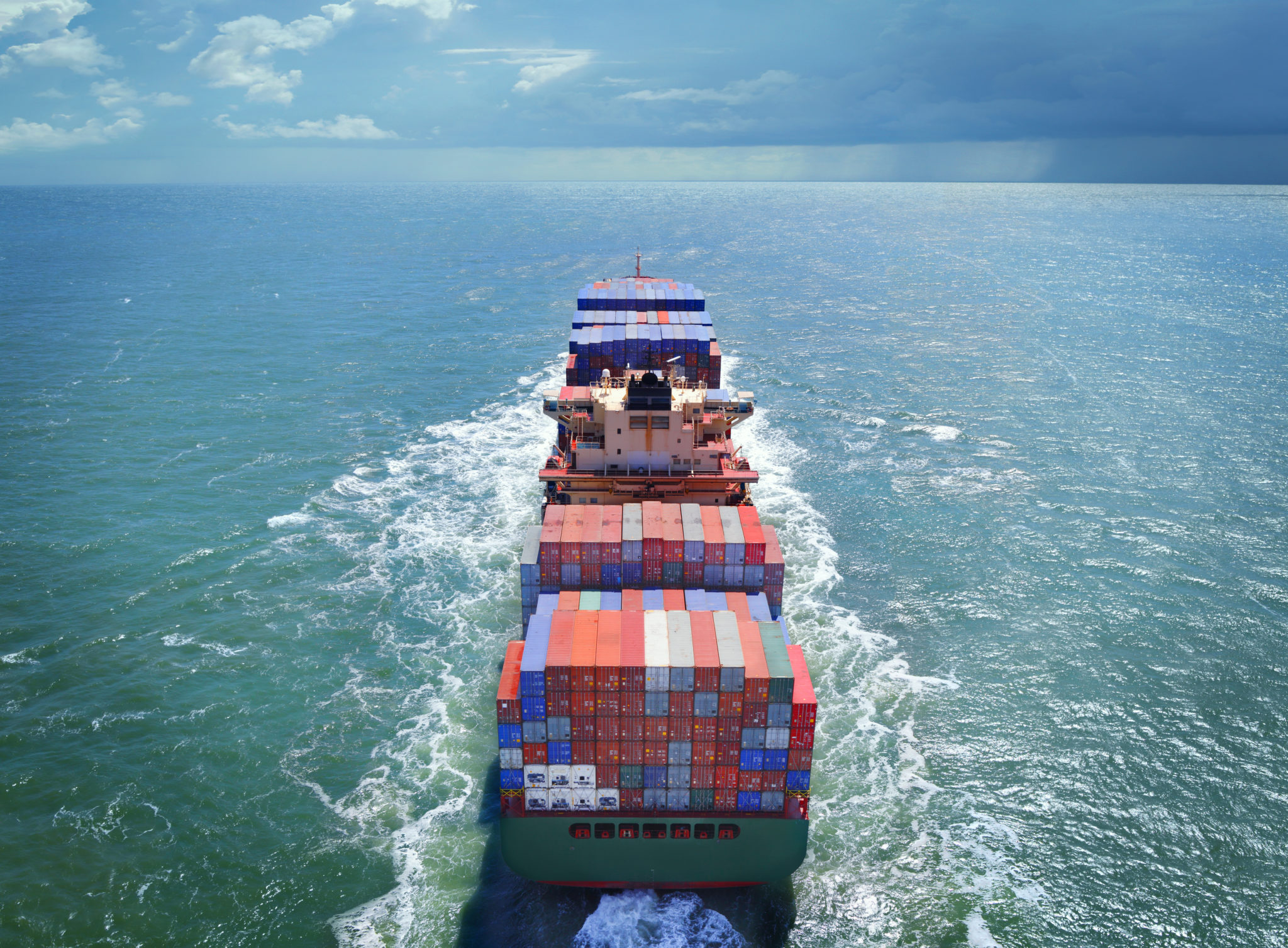 Aerial view of freight ship with cargo containers